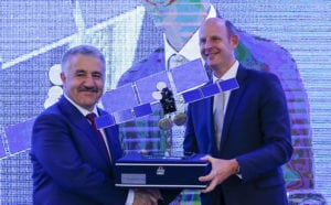 Turksat Transport, Maritime and Communication Minister Ahmet Arslan presenting a model satellite as a gift to Inmarsat CEO Rupert Pearce.