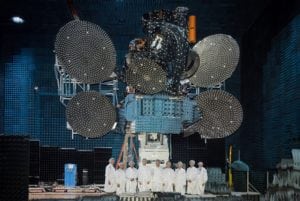 AsiaSat technicians stand in front of the AsiaSat 9 satellite. Photo: AsiaSat