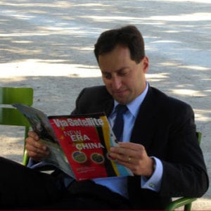 Dan Goldberg reading Via Satellite in 2008.