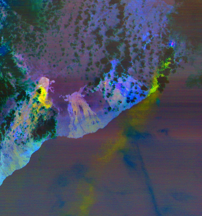 Massive sulfur dioxide plumes, extracted from ASTER's multiple thermal bands, are shown here in yellow and green. NASA