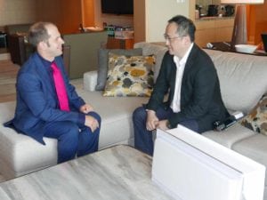 Mark Holmes (left) interviewing Tom Choi (right) in Singapore.