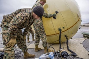 A Ground Antenna Transmit and Receive (GATR) inflatable satellite antenna being adjusted. Photo: U.S. Marine Corps/Lance Cpl. Joshua W. Brown