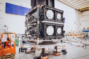 Boeing team members prepare the first two O3b mPOWER satellites for containerization ahead of delivery to SES. Photo: Boeing